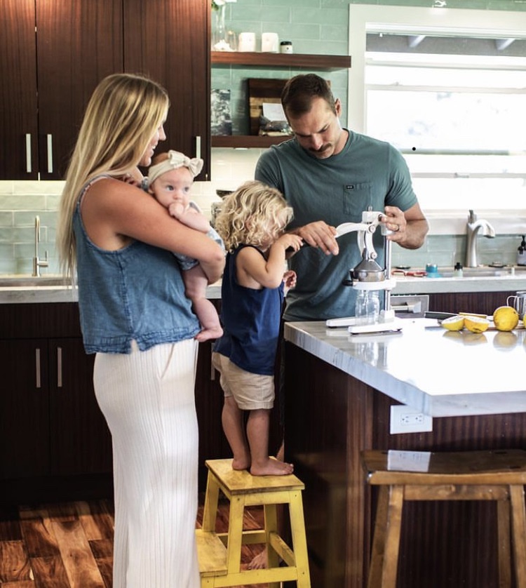The dirks fam makes fresh orange juice.